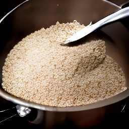 a bowl of mixture with rolled oats and breadcrumbs.