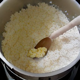 the food processor will create a mixture of cheese curds, pecans, eggs, soy sauce, and chopped onions.