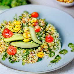 the avocado-nut mixture is mixed with a spoon, then served to a plate.