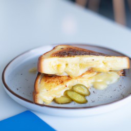 

Cheese melt with pickle is a delicious and nutritious snack made of white bread, cheddar cheese, and dill pickles - free from eggs, nuts, and soy.