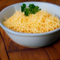a bowl containing pulp, parsley, breadcrumbs, grated cheese, garlic, and black pepper mixed together.