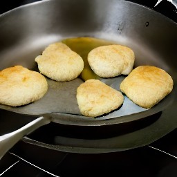 a pan of fried biscuits.