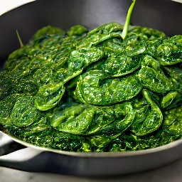 a dish of spinach and garlic cooked in butter and olive oil, with lemon juice added.
