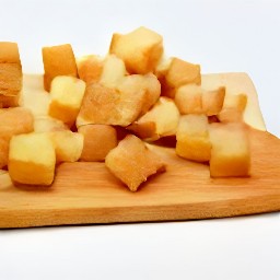 garlic that is peeled and minced, and bread that is cut into cubes.