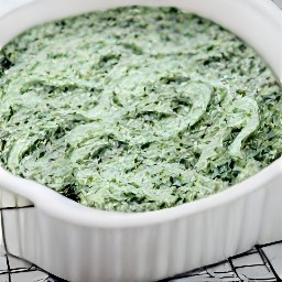 the spinach mixture is spread in a shallow ovenproof dish.