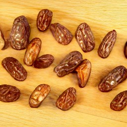pitted dates that have been slit open on one side.
