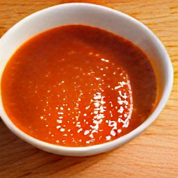 a bowl of crushed tomatoes mixed with milk and three-quarters of the tomato juice.