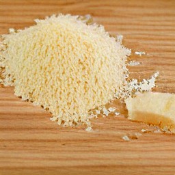 the parmesan cheese is grated into small pieces.