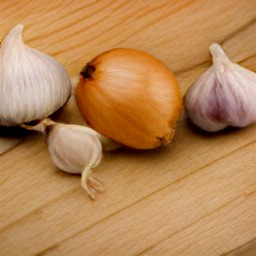 a peeled onion and garlic.