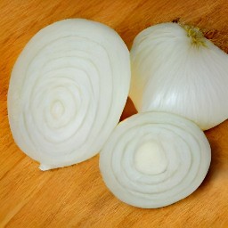 an onion that has been peeled and cut into slices.