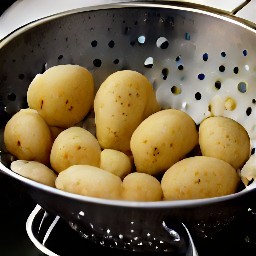 potatoes that have been rinsed and drained in a colander.