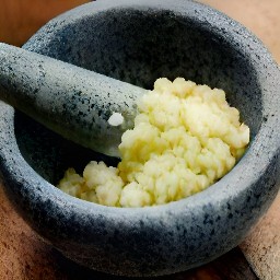 a paste made from the crushed garlic.