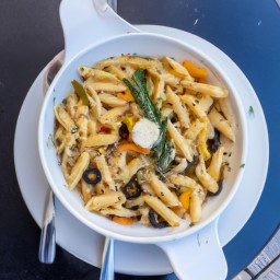 

A delicious and healthy Greek Penne Pasta Lunch made with penne, pine nuts, spinach, tomatoes, feta cheese and olives - all eggs-free!