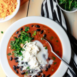 

Delicious and nutritious black bean soup is a perfect gluten-free, eggs-free, and nuts-free dinner option that combines refried beans, black beans, corn, cheddar cheese and sour cream.