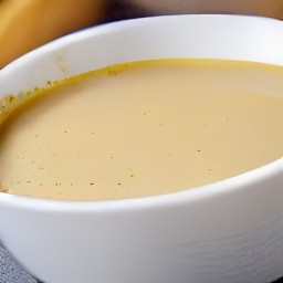 a bowl of mixed yellow mustard, balsamic vinegar, olive oil, salt, and black pepper.