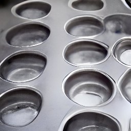 the muffin tin coated with a thin layer of cooking spray.