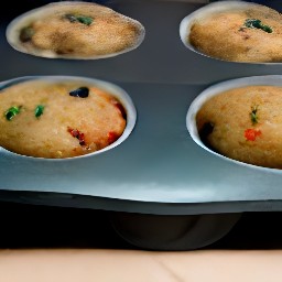 the muffin tin will have 12 muffins in it, 2/3 full with batter.