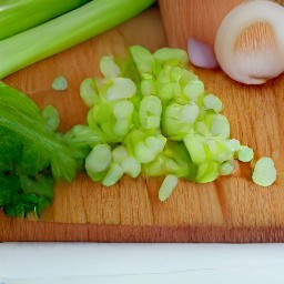 you will have chopped carrots, celery sticks, and tomatoes. then, you will have peeled and minced onions and garlic.