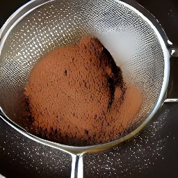 all-purpose flour, cocoa powder, and baking soda in a pan with a strainer.
