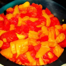 a fried vegetable mix of bell peppers and tomatoes.