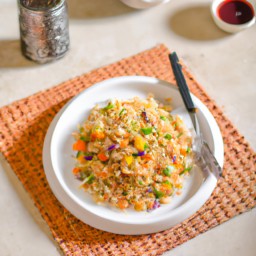 

Delicious and gluten, nut, lactose-free Asian fried rice made with bell peppers, vegetable oil, white rice and eggs for a healthy meal.