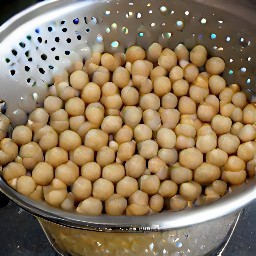 the chickpeas are drained in a colander.