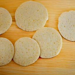 the dough is cut into circles with a cookie cutter.