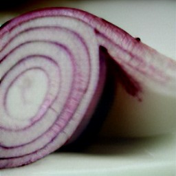 a bowl of peeled red onions and garlic.