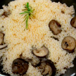 a plate of stir-fry with ricotta and parmesan cheese garnished with parsley.