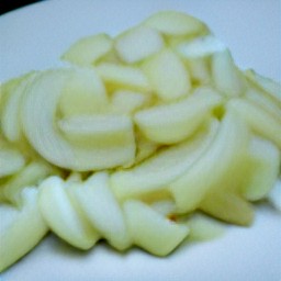 after peeling the onion and garlic, chop them into small pieces. then, slice the leeks thinly and chop up the rosemary so it is in smaller pieces.
