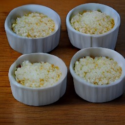 a ramekin with olive oil, eggs, salt, black pepper, tarragon, cheese and whipping cream.