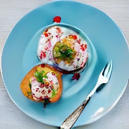 halved sweet potatoes on a plate topped with the yogurt mixture, walnuts, pomegranate seeds, and coriander.