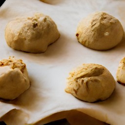 the output is a baking sheet lined with wax paper and peanut balls.