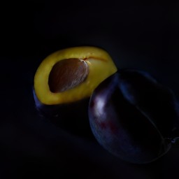 the plums are cut in half.