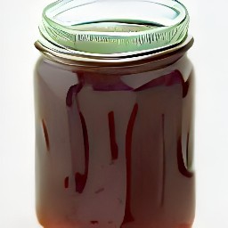 the plums mixture is transferred to a jar and covered with a lid.