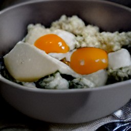 a bowl of whisked eggs with chopped spinach, basil, ricotta cheese, 3 oz grated mozzarella cheese, and grated parmesan cheese.