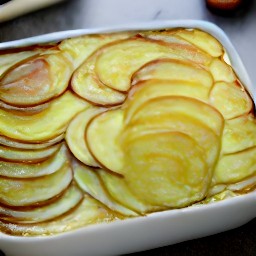 a dish that has been covered in aluminum foil and baked for 20 minutes. the dish is then taken out of the oven, the aluminum foil is removed, and the dish is returned to the oven for 55 minutes