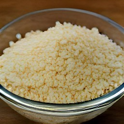 the minced garlic is transferred to a bowl.