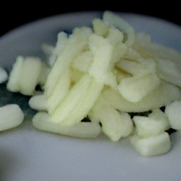 after peeling and chopping an onion, peel and mince garlic.