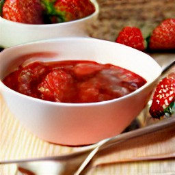 the strawberry compote is served in a serving bowl.