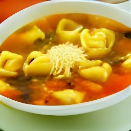 a bowl of vegetable soup with cheese tortellini, grated parmesan cheese, and chopped basil.
