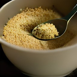 a bowl of breadcrumbs, italian seasoning, garlic powder, parsley flakes, oregano, basil and parmesan cheese that are mixed together.