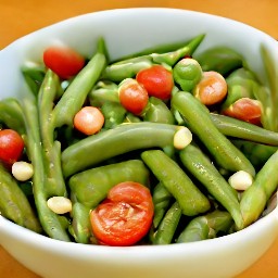 a salad consisting of crushed garlic, olive oil, chopped basil, lemon juice, salt, and black pepper mixed with cherry tomato halves and pine nuts.