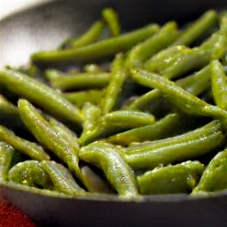 a dish of garlic green beans cooked in olive oil.