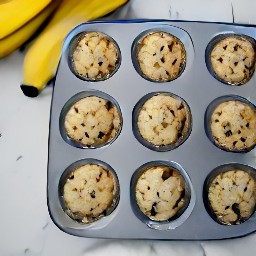 the batter is divided into the muffins tin.
