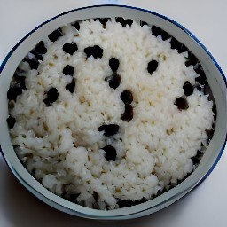 a plate of rice and black beans that are warm throughout.