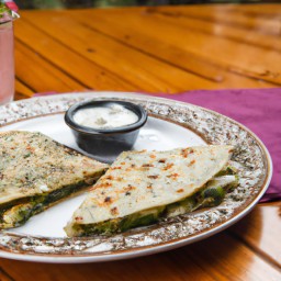 

This delicious Mexican snack pairs fresh zucchini and creamy pesto with avocado for a tasty, eggs-free quesadilla.