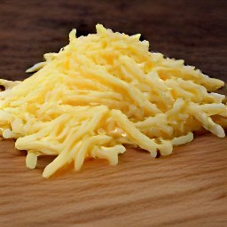 the monterey jack cheese is shredded into small pieces.