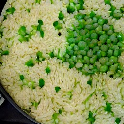 lemon rice with peas and green onions.
