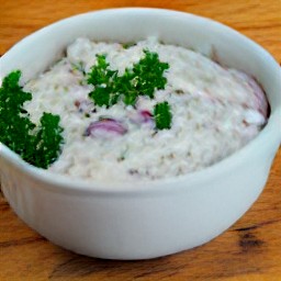 a bowl of salad ingredients that are mixed together.